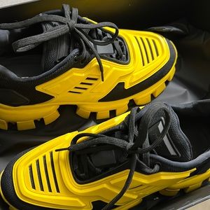 I am selling black and yellow Prada sneakers.